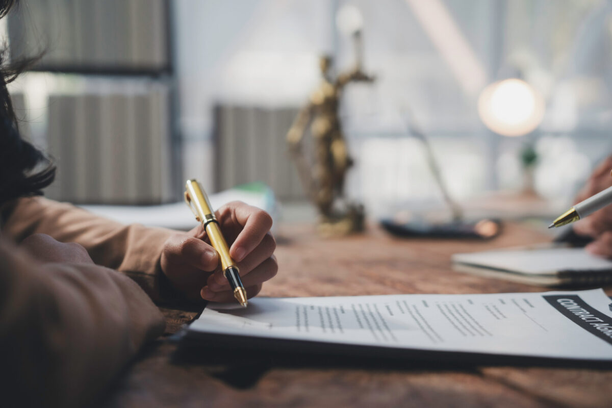 Businesswoman Signing Contract Agreement After Successful Legal Consultation Businesswoman Signing Contract Agreement After Successful Legal Consultation